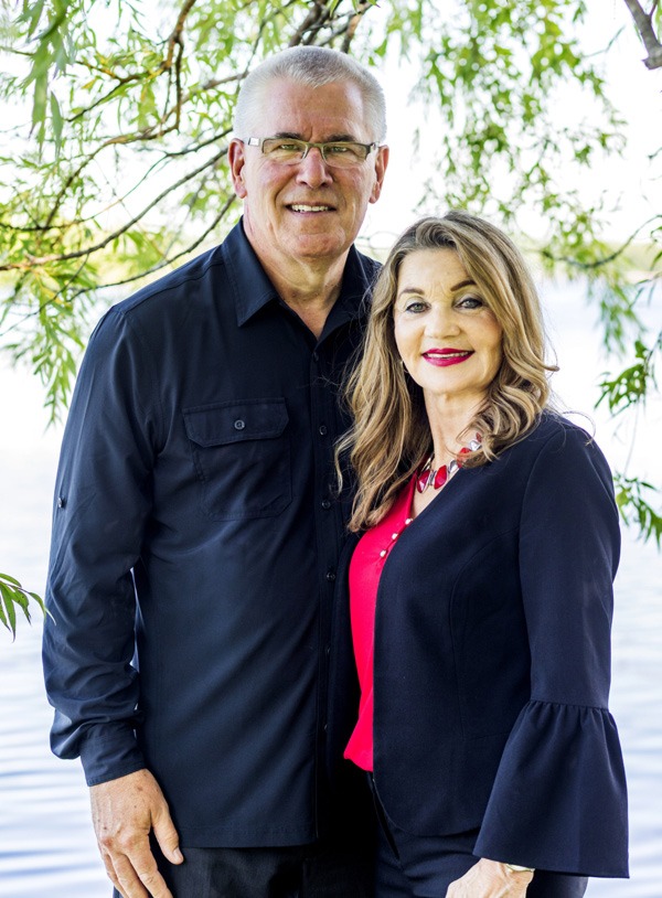 Deborah and Wayne McCuen under the willow tree